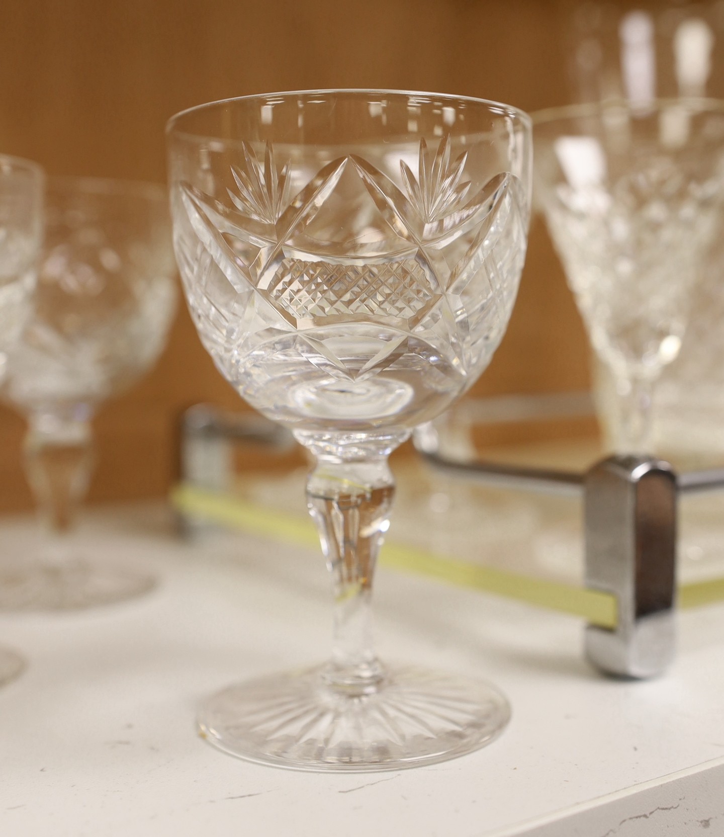 A mid century chrome and perspex drinks tray with 6 cocktail glasses, mixing glass and 8 wine glasses